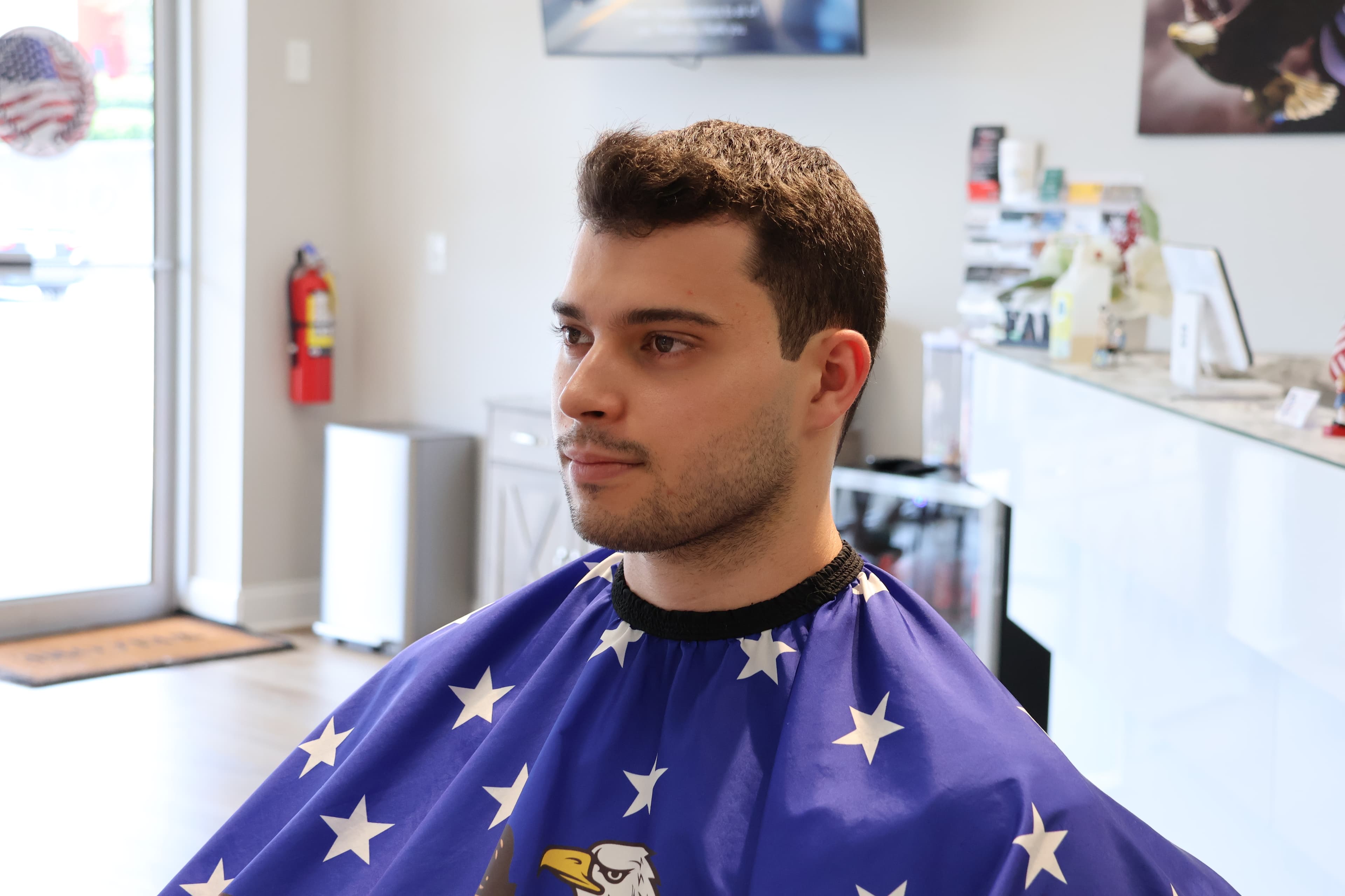 Welcoming barbershop experience with a customer