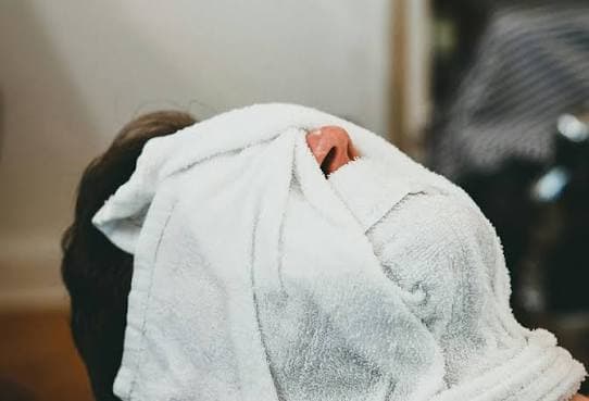 Hot towel treatment during a straight-razor shave